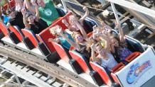 Guests riding Comet roller coaster at Six Flags Great Escape