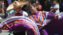 Traditionally dressed dancers at a Latino festival
