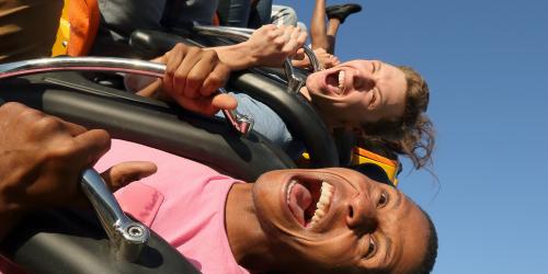 Riders in the sky on pendulum swinging ride