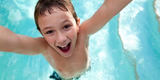 kid having fun at the water park