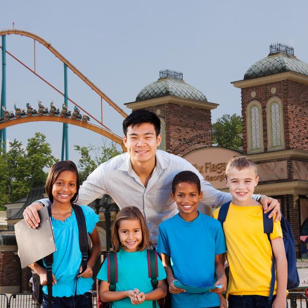 Teacher and kids in front of the park